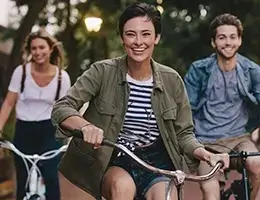group of young adults riding bikes