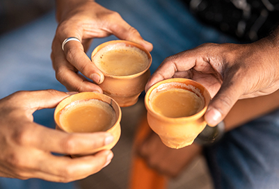 People clinking tea cups